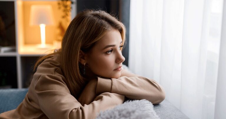 Stressed woman processing the possibility of an unexpected pregnancy.