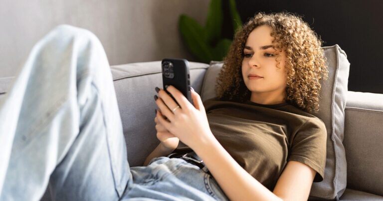 A woman uses her phone to research important facts about medical abortion.