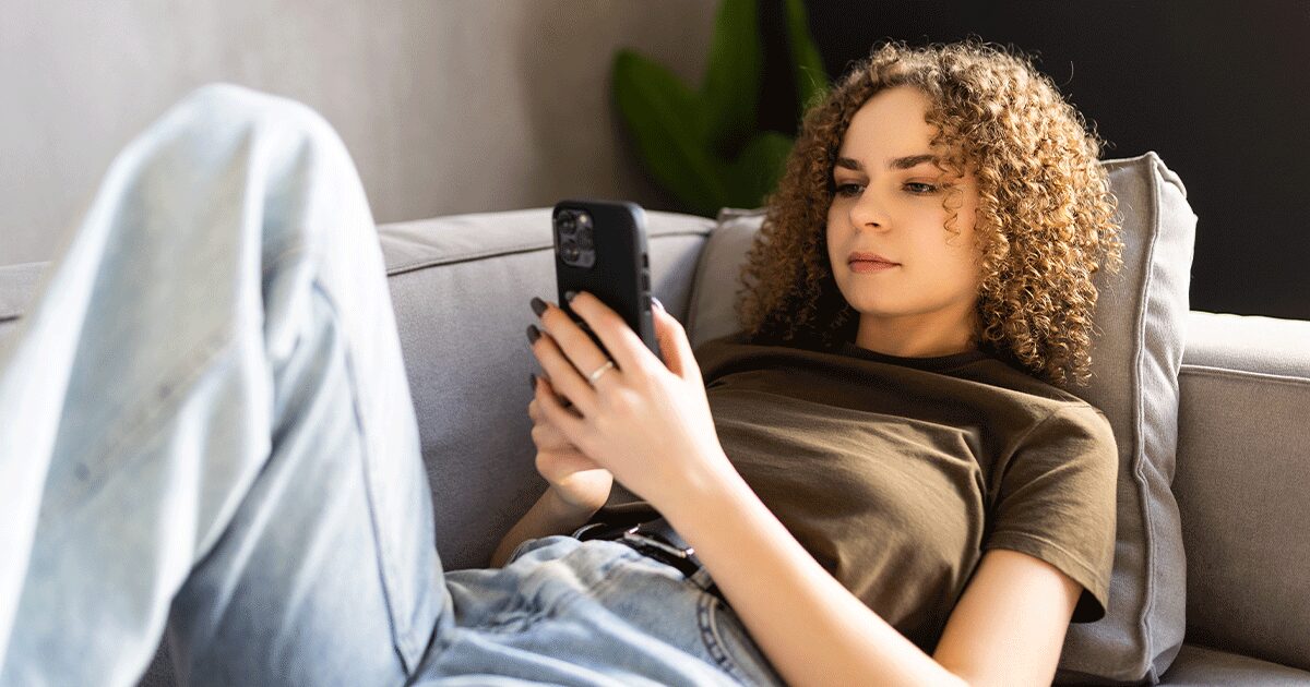 A woman uses her phone to research important facts about medical abortion.